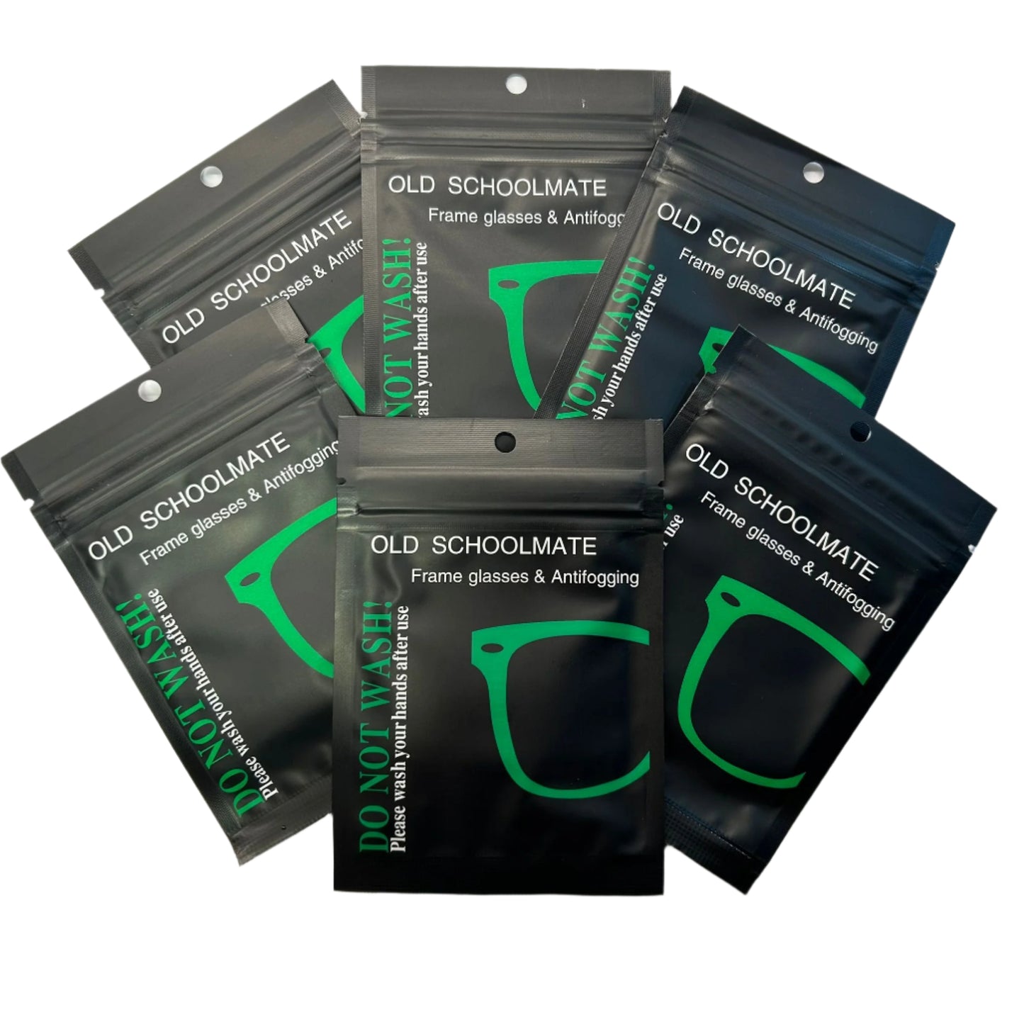 Multiple packages of Old Schoolmate glasses cleaning solution on a white background