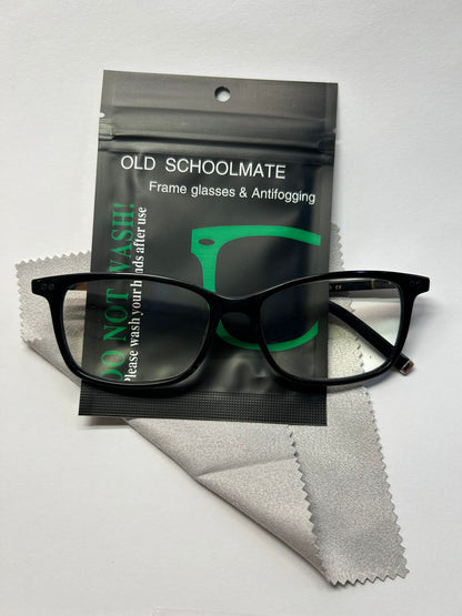 Black glasses with Old Schoolmate packaging and cleaning cloth on a white background
